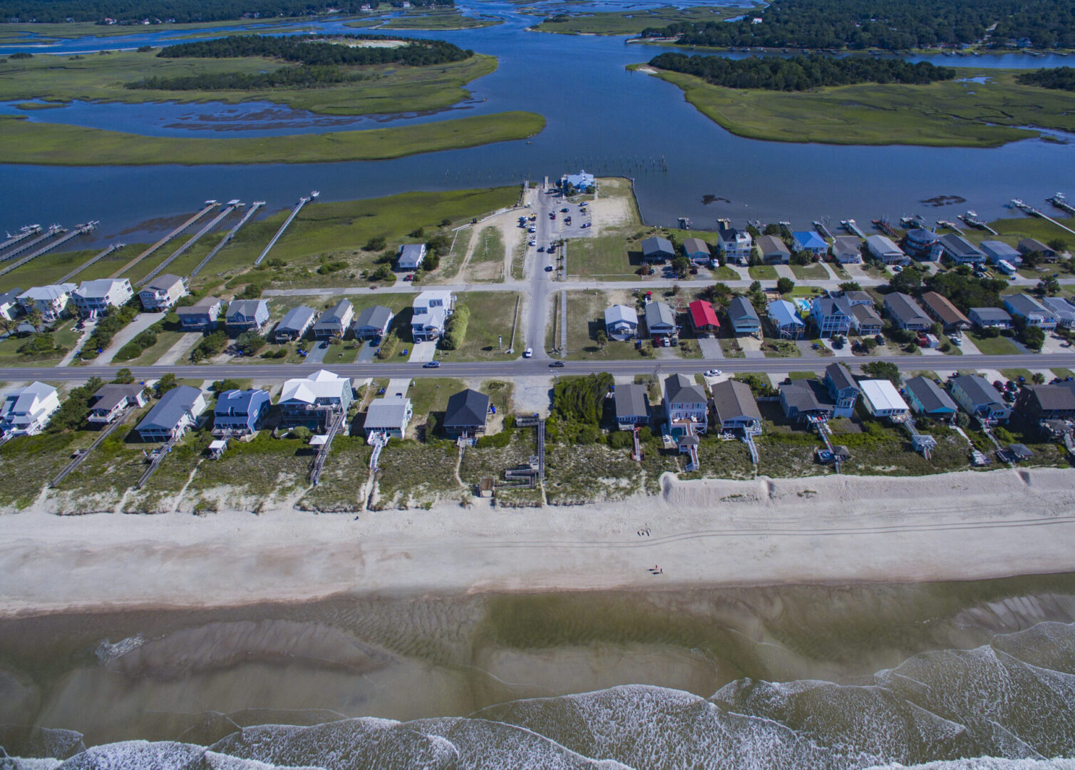 A view of houses on the beach from above.