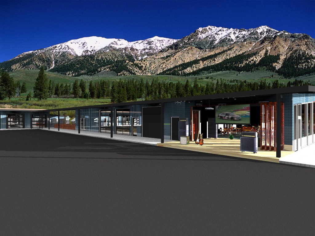 A train station with mountains in the background.