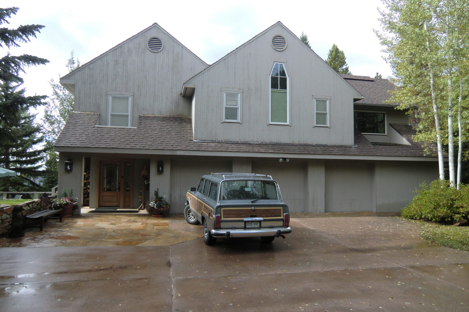 A car parked in front of a house.